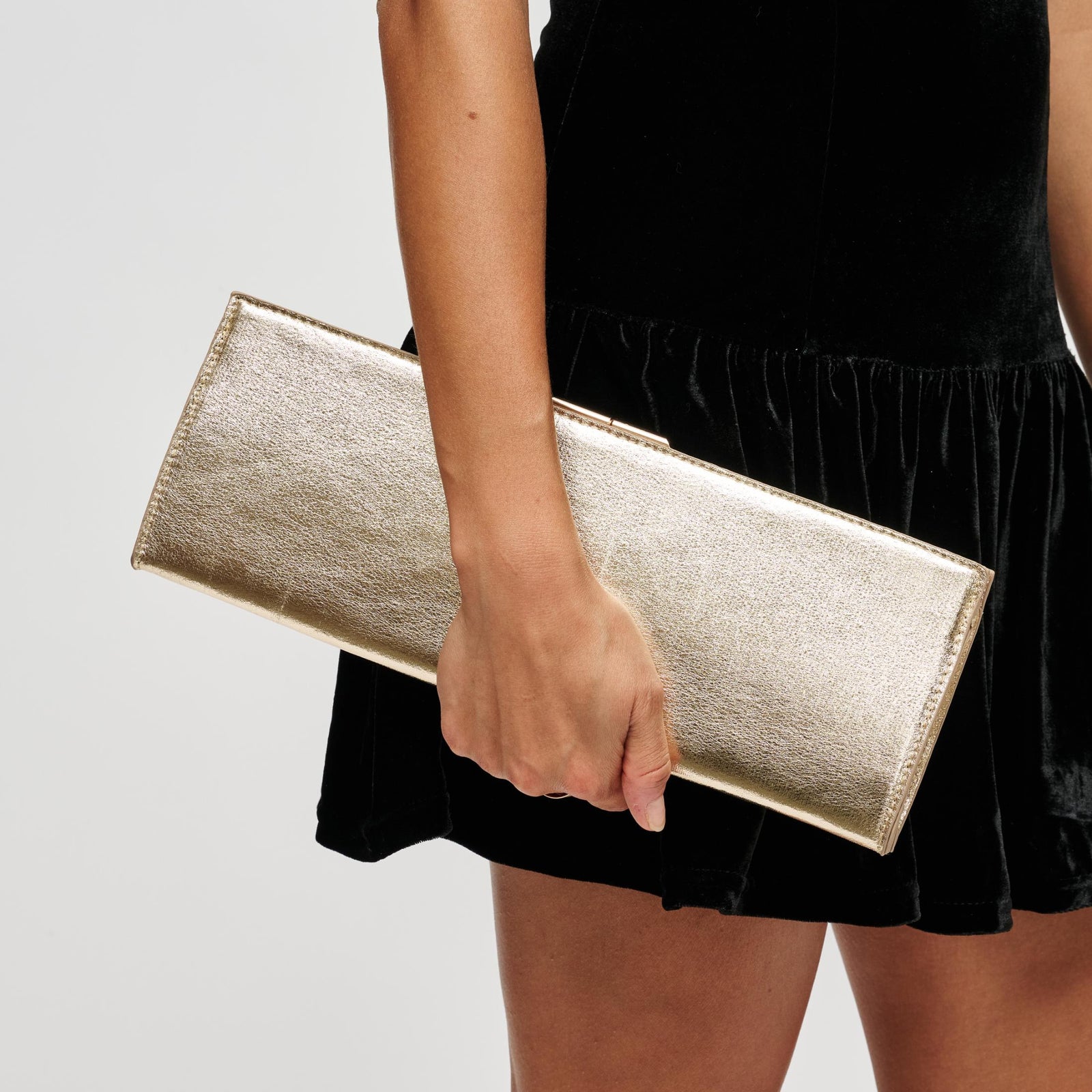 Woman wearing Silver Urban Expressions Nazlee - Met Clutch 840504212659 View 1 | Silver