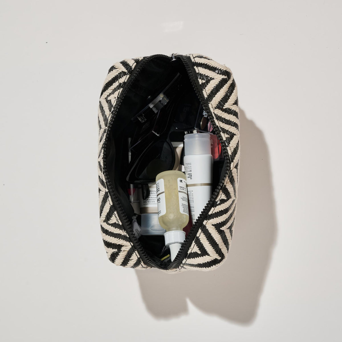 Woman wearing Black White Urban Essentials Chevron Chic Cosmetic & Travel Organizer Pouch 840611152633 View 2 | Black White