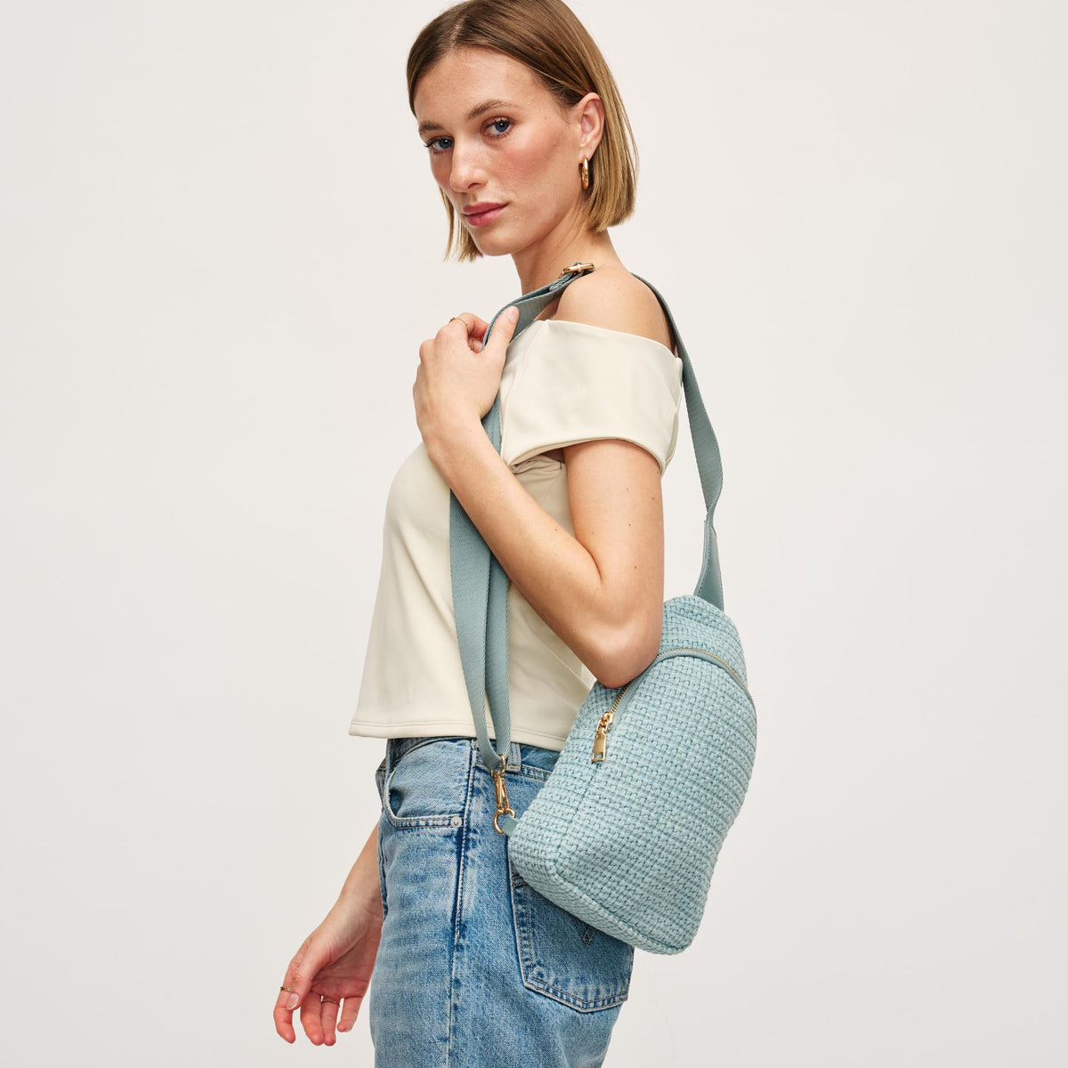 Woman wearing Blue Urban Expressions Jean Sling Backpack 840611146540 View 2 | Blue