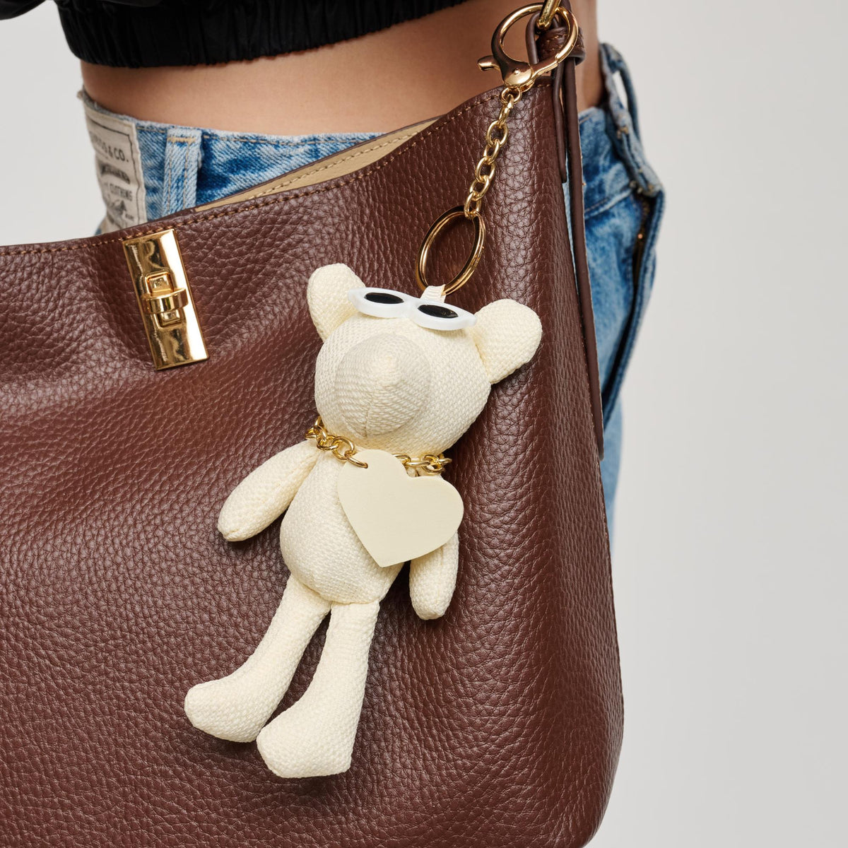 Woman wearing Ivory Urban Expressions Ross Keychain Charm 840504201028 View 1 | Ivory