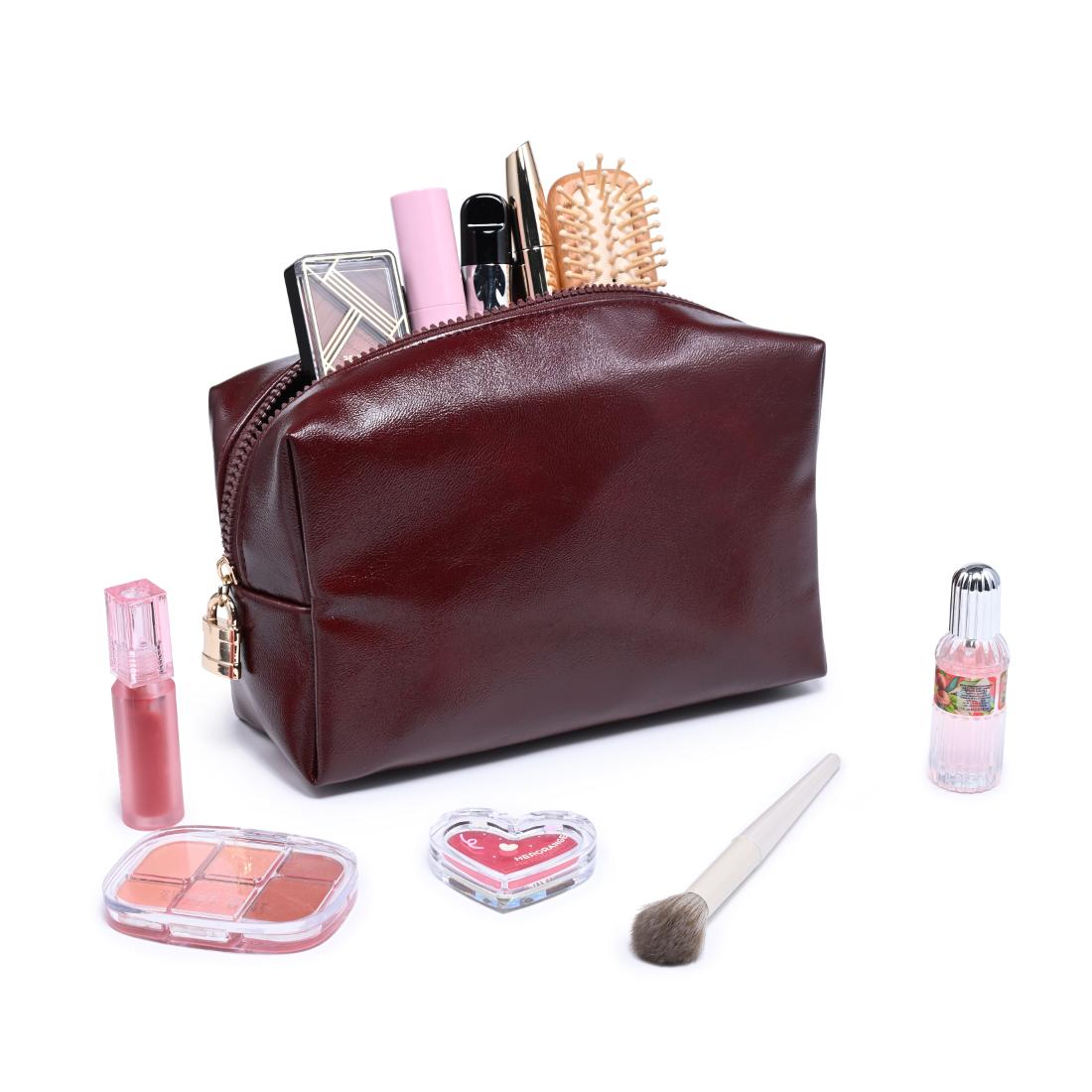 Woman wearing Burgundy Urban Essentials The Vault Cosmetic & Travel Organizer Pouch 840504210075 View 1 | Burgundy