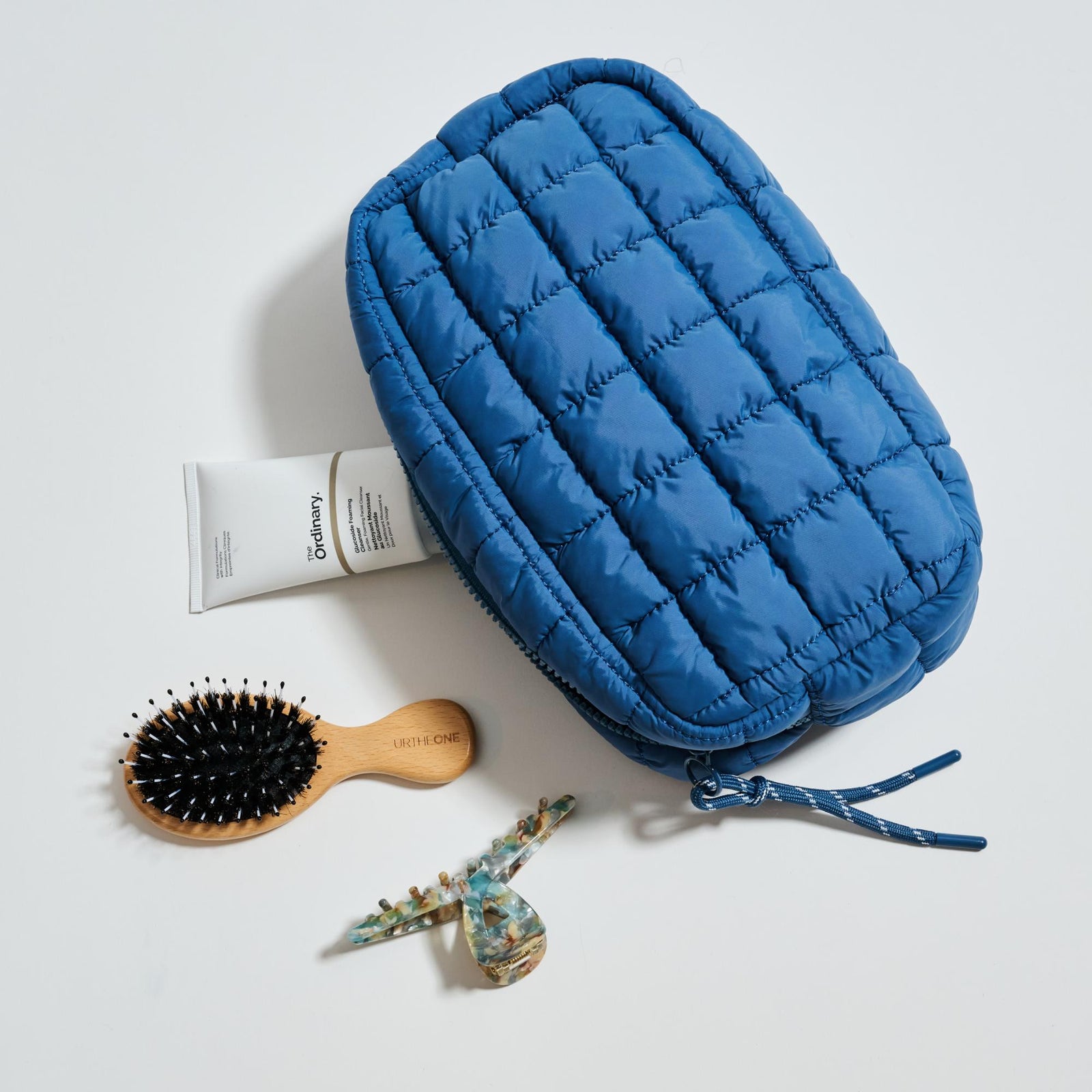 Woman wearing Periwinkle Urban Expressions Cloud Nine - Quilted Puffer Nylon Cosmetic Pouch 840611143785 View 1 | Periwinkle
