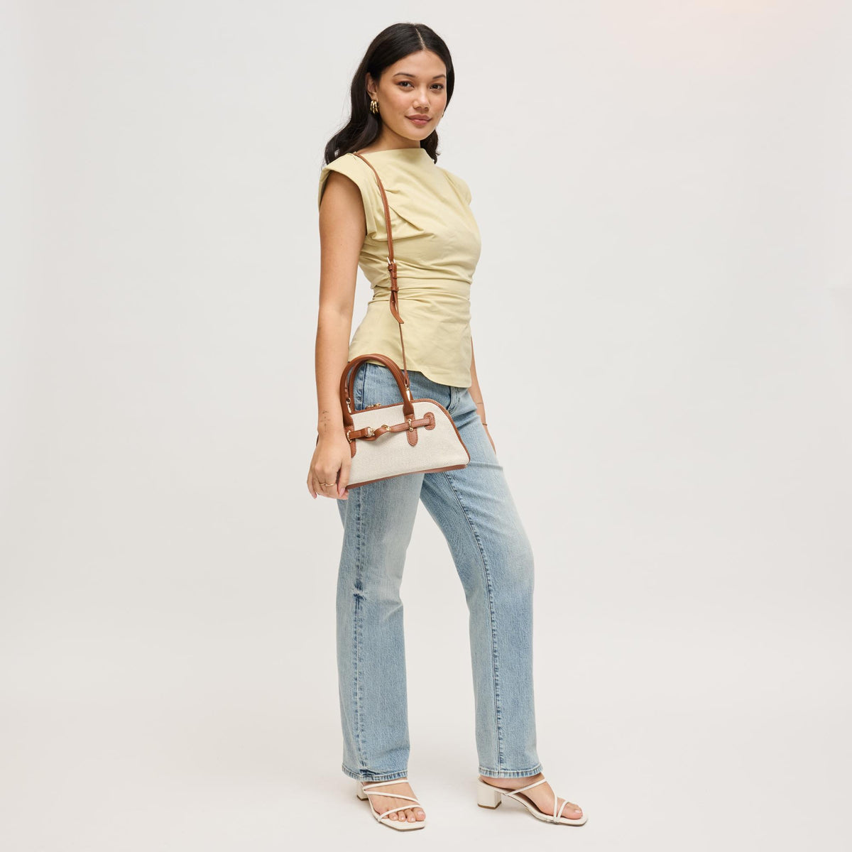 Woman wearing Ivory Tan Urban Expressions Amelia Crossbody 840504207877 View 3 | Ivory Tan