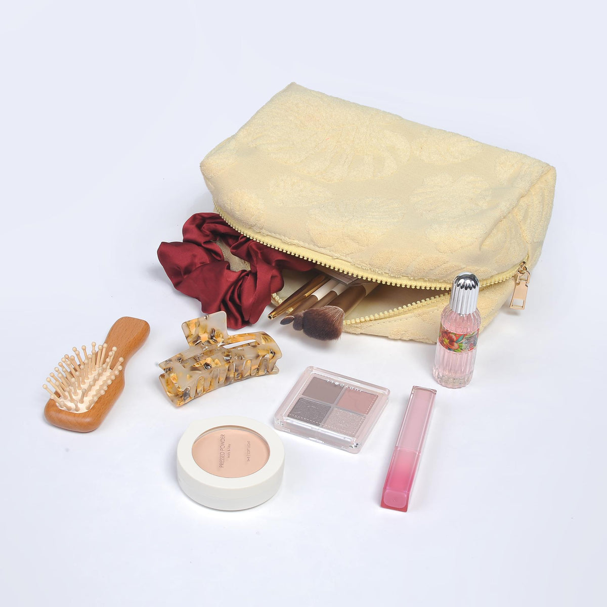 Woman wearing Yellow Urban Essentials Palm Breeze Cosmetic & Travel Organizer Pouch 840611195326 View 1 | Yellow