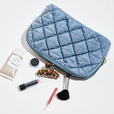 Woman wearing Dusty Blue Urban Essentials Cloud Kiss - Quilted Puffer Nylon Cosmetic & Travel Organizer Dome Pouch 840611197115 View 1 | Dusty Blue
