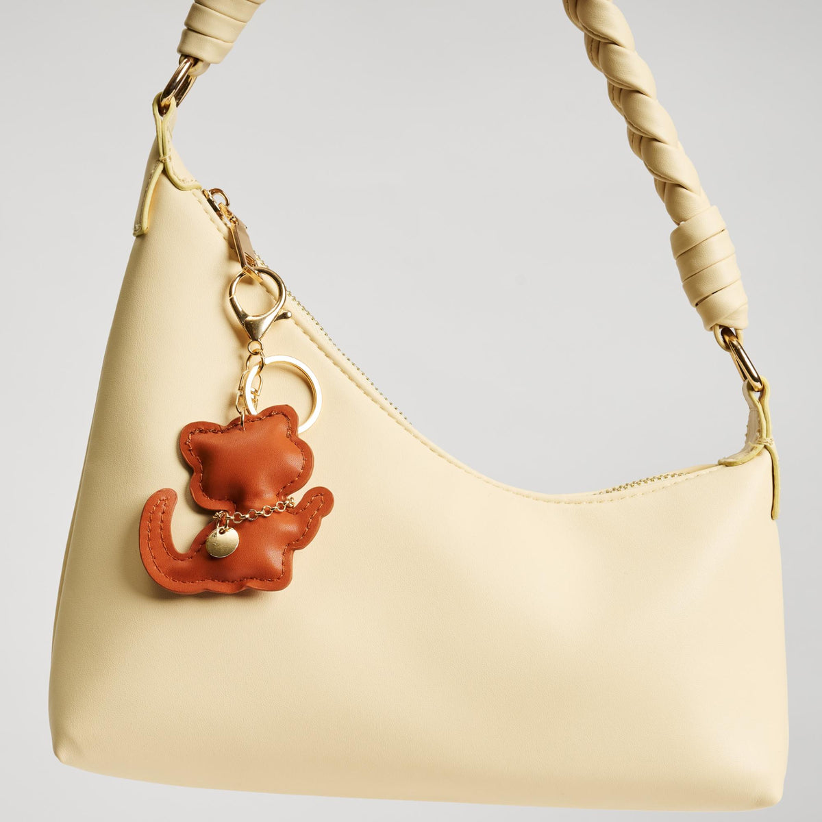 Woman wearing Tan Urban Expressions Kittie Keychain Charm 840611150745 View 2 | Tan