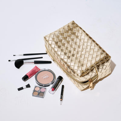 Woman wearing Gold Urban Essentials Weave & Wander Cosmetic & Travel Organizer Pouch 840611197856 View 1 | Gold