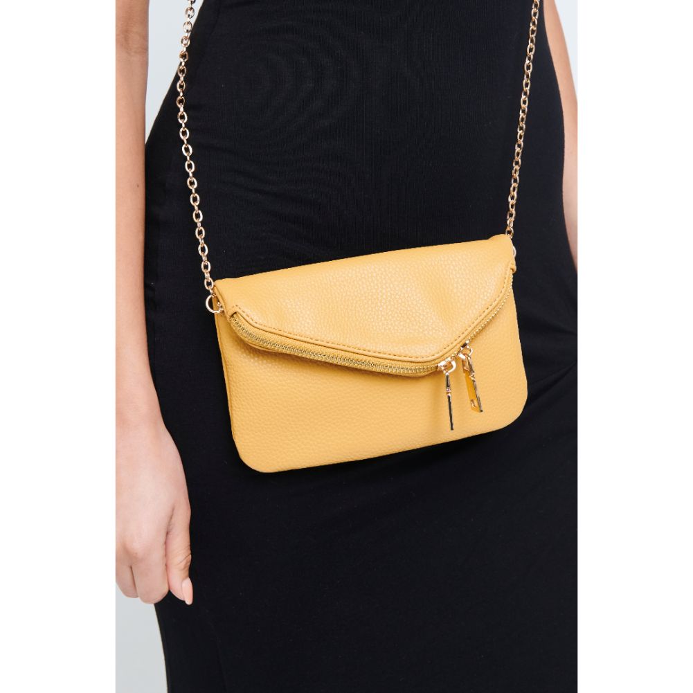 Woman wearing Mustard Urban Expressions Lucy Wristlet 840611147882 View 1 | Mustard