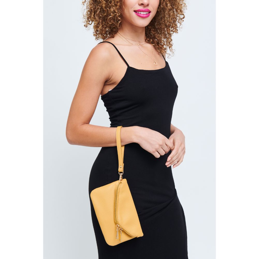 Woman wearing Mustard Urban Expressions Lucy Wristlet 840611147882 View 2 | Mustard