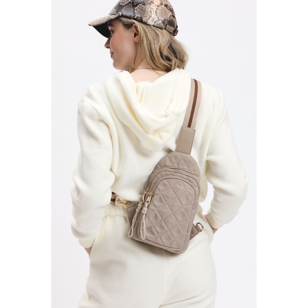 Woman wearing Nude Urban Expressions Ace - Quilted Nylon Sling Backpack 840611116598 View 1 | Nude