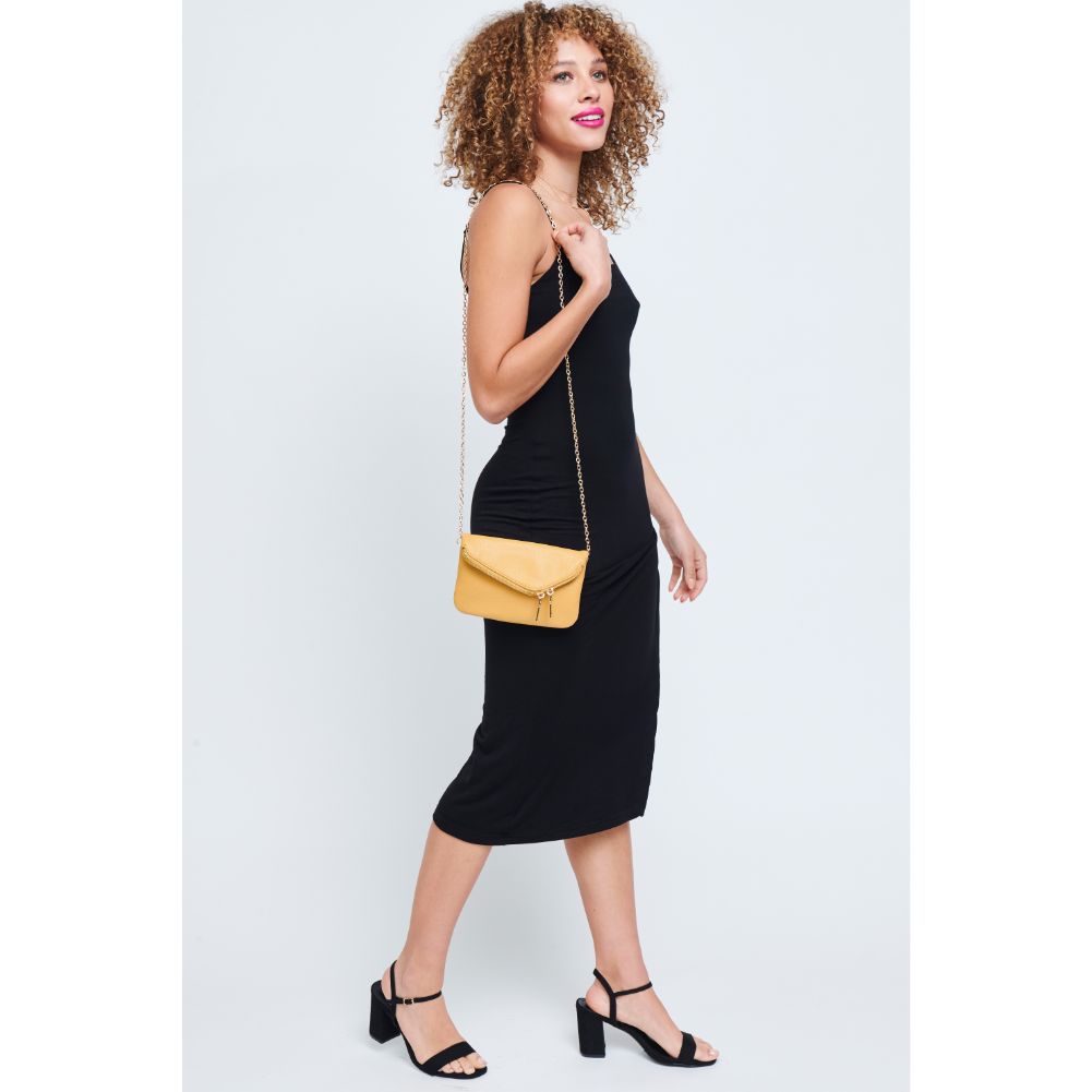 Woman wearing Mustard Urban Expressions Lucy Wristlet 840611147882 View 4 | Mustard