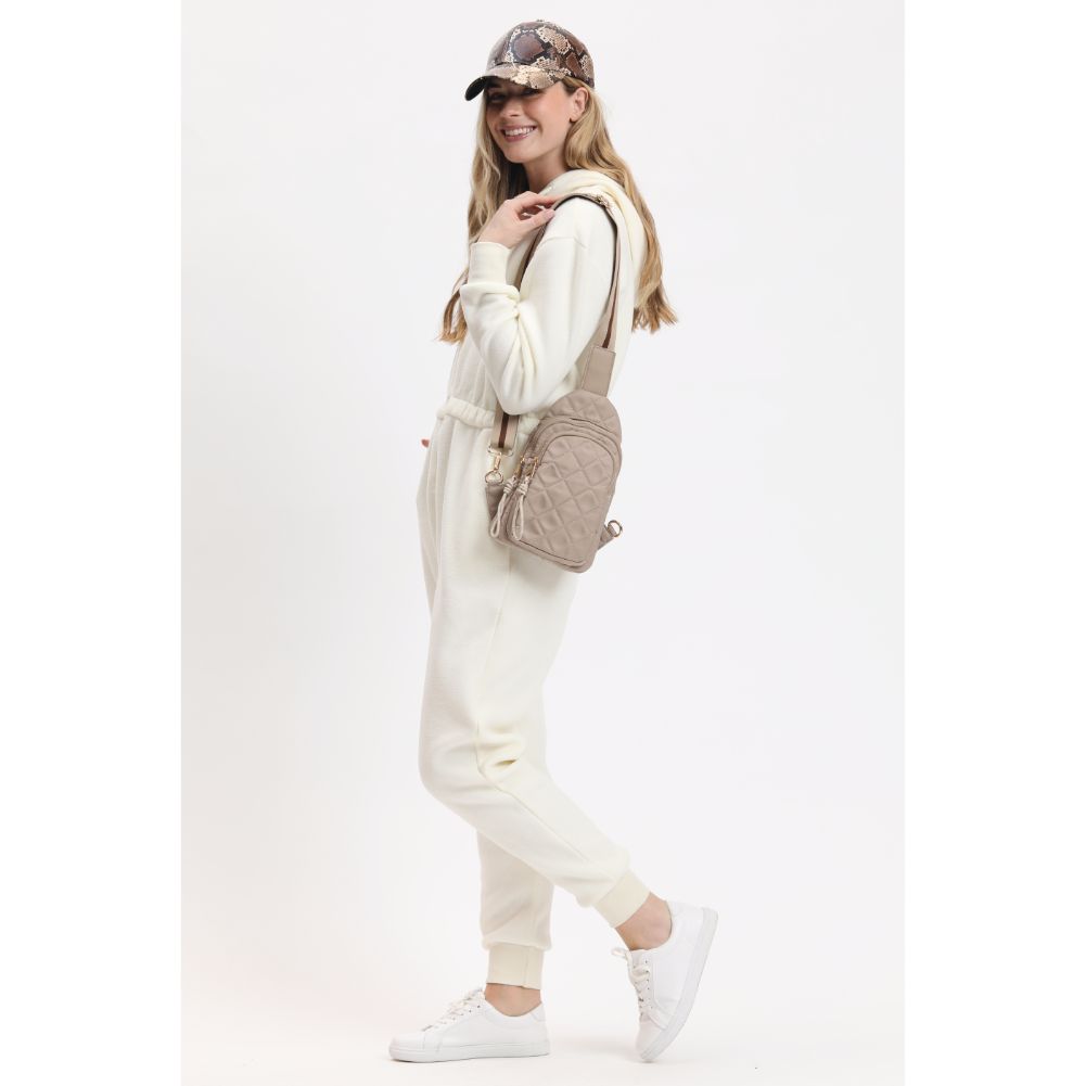 Woman wearing Nude Urban Expressions Ace - Quilted Nylon Sling Backpack 840611116598 View 3 | Nude